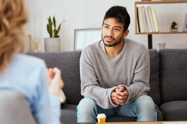 young male attending a therapy session with professional before EMDR treatment