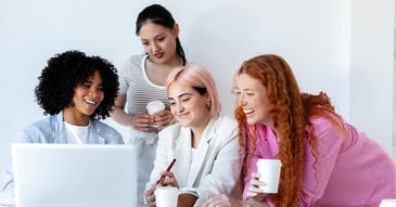 Four women at the workplace engaging in workplace health and safety ( whs ) training from safety consultants and organisational psychologist for improved wellbeing