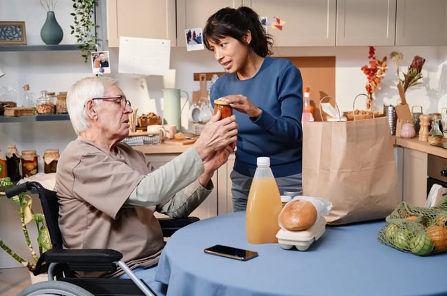 woman providing home help services to elderly 